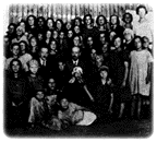 Janusz Korczak with children and with philantropist Izaak Eliasberg, 19??.
