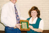 Thumbnail of Bruce Burnham, receiving the Metropolitan Life Insurance's Teacher of the Year Award from Anna Marie Terry Ippolito