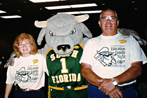 Photo of Dianne and John Rivera were greeted by Rocky the Bull at the Education Family Night Reception, 1995