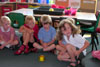 Photo of a small-grouping of students engaged in classroom activities.