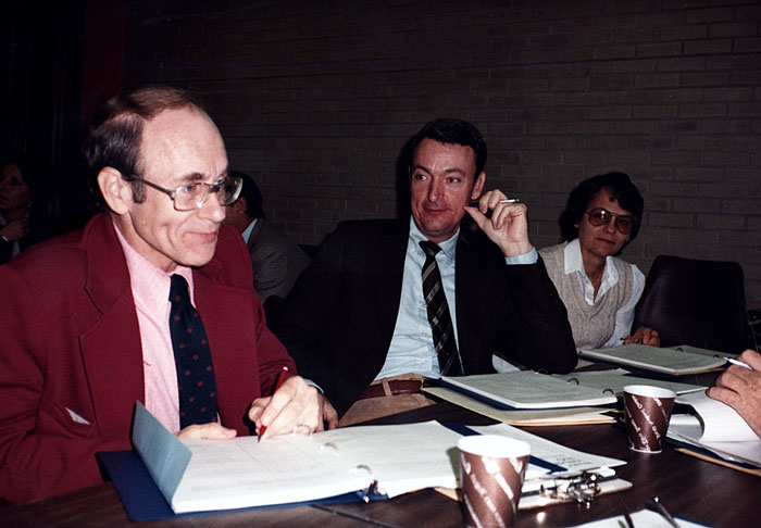 Faculty members at a table