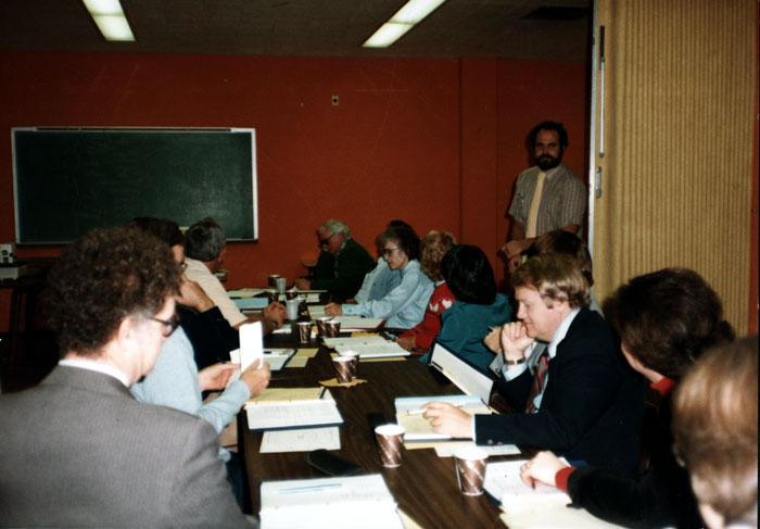 Faculty in a conference room