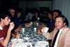 Thumbnail of a group of faculty sitting down to a meal