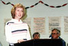 Thumbnail of a woman at a podium speaking to a group of faculty