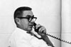 Thumbnail of Dr. Walter Musgrove talking on the phone