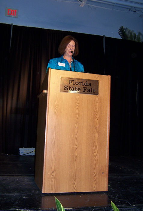 Dean Colleen S. Kennedy standing at a podium