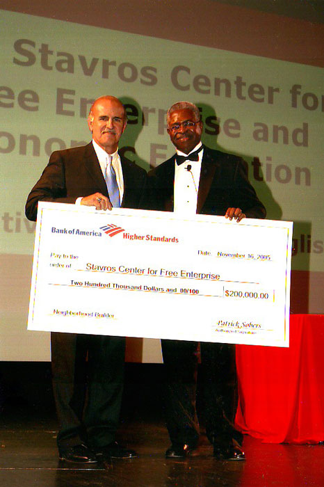 two men holding a giant check