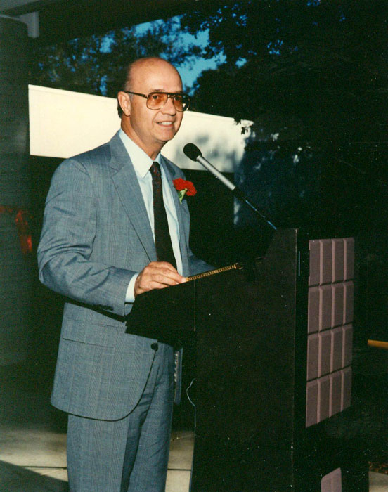 a man speaking at a podium