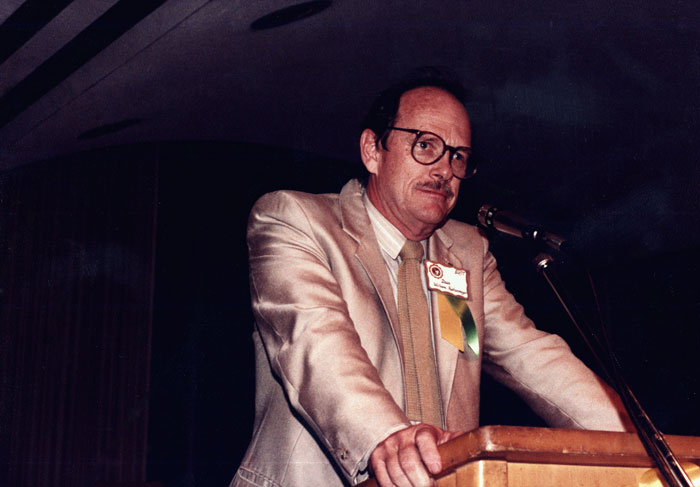Dean William Katenmeyer at a podium