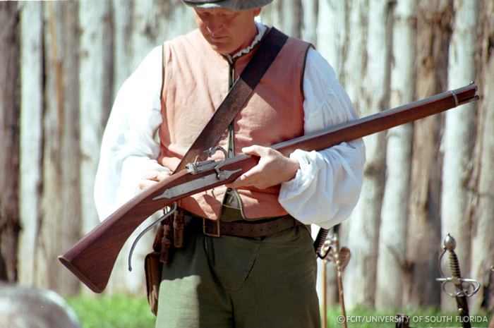 Conquistador displaying a musket