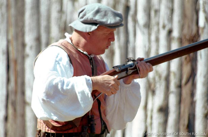 Conquistador displaying a musket
