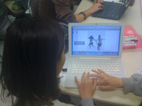 A student uses a laptop in the classroom