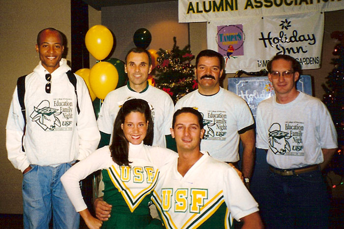 USF College of Education alumni joined by USF cheerleaders.