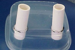photo of short pieces of PVC pipe glued into the plastic dish