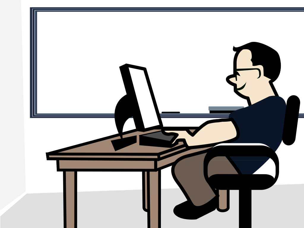 teacher using computer and desk