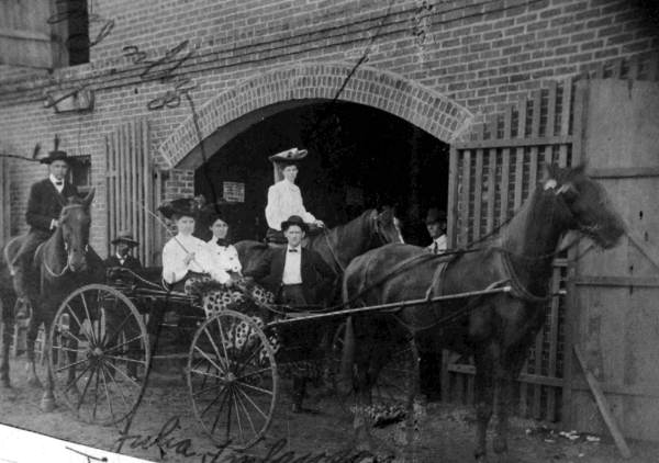 Group on horses with buggy: Monticello, Florida